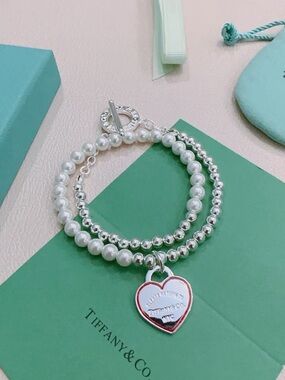 Tiffany   &   Co..  Pearl and Silver Bead Bracelet with Red-Edged Heart Charm